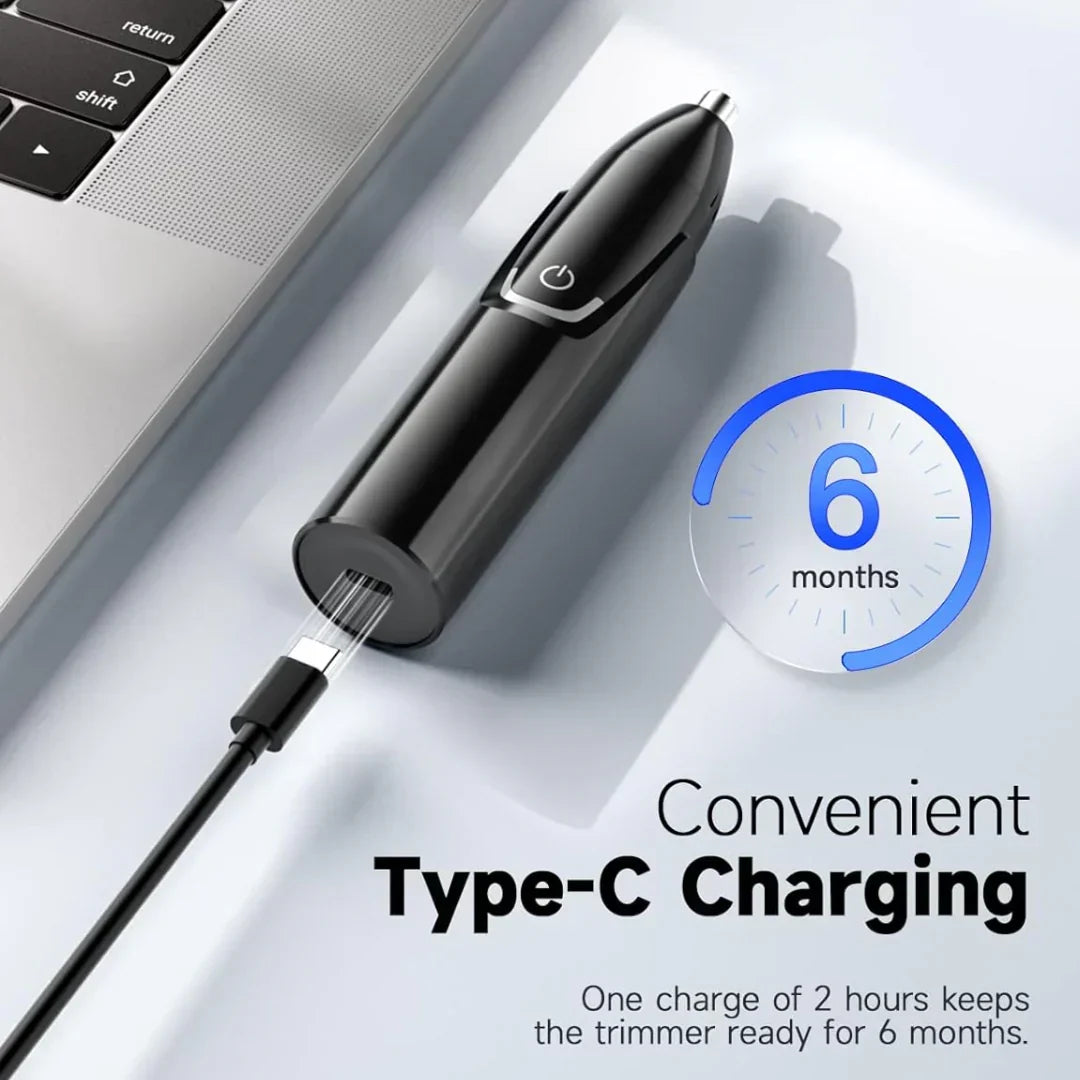 Trimmer som laddas via USB-C nära en bärbar dator