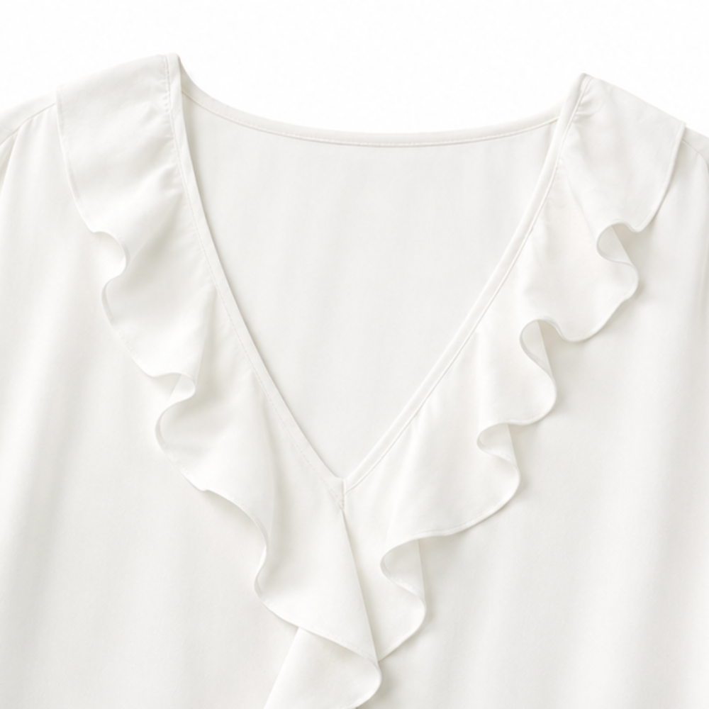 Bakifrån vy av mönstrad damblus med 3/4-ärm för en sofistikerad look