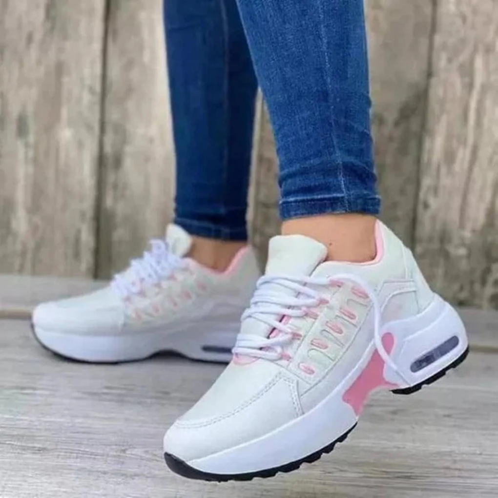 Vita dam-sneakers med rosa detaljer och snörning