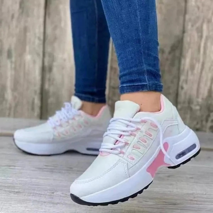 Vita dam-sneakers med rosa detaljer och snörning