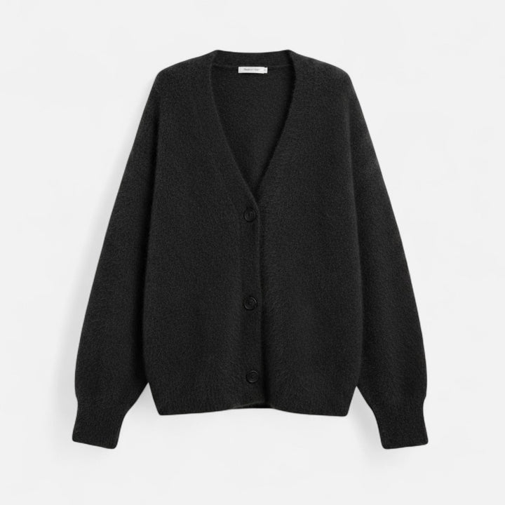 Modern damtopp i stickad design med dekorativa knappar