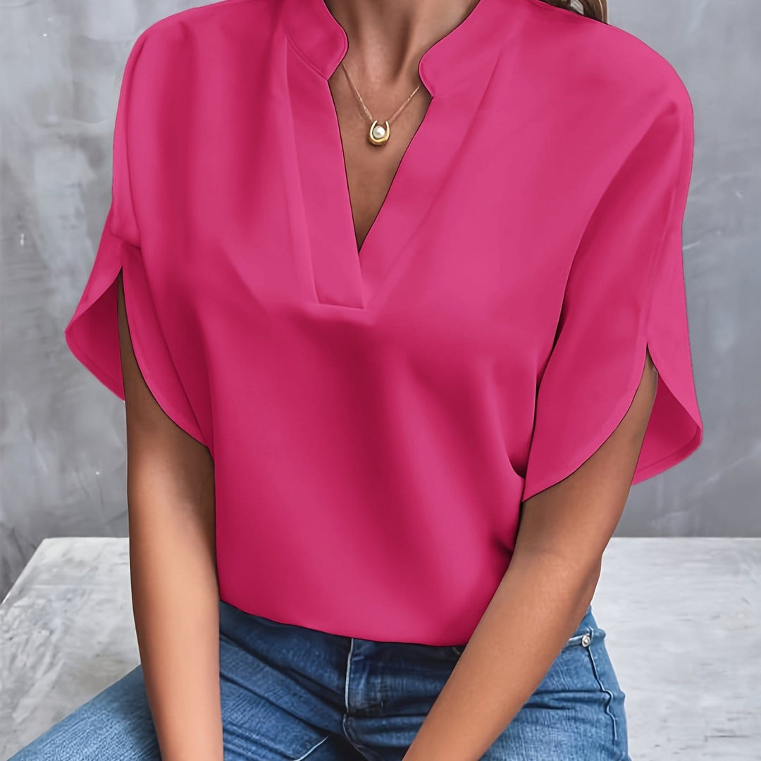 Stilfull topp med V-ringning och elegant drapering