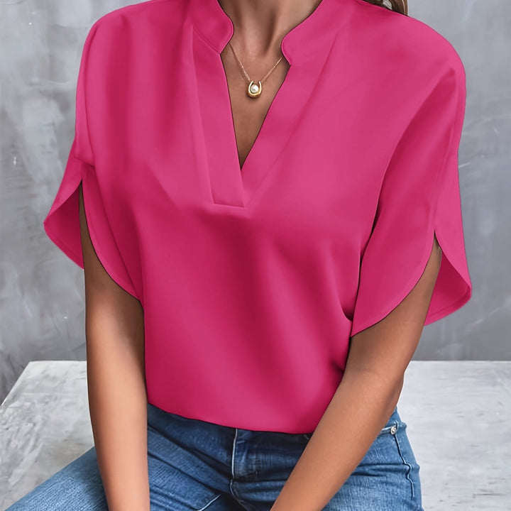 Stilfull topp med V-ringning och elegant drapering