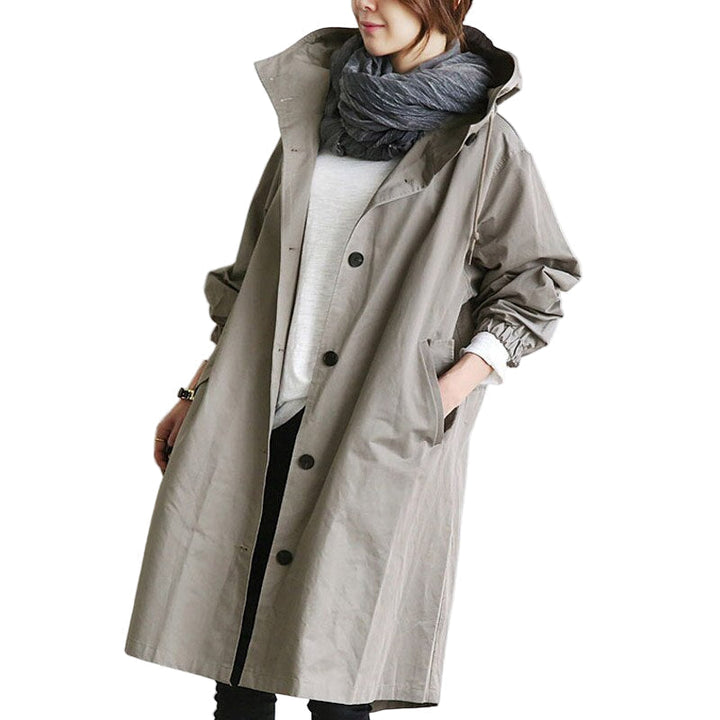 Elegant grå vattentät damjacka och trenchcoat med huva