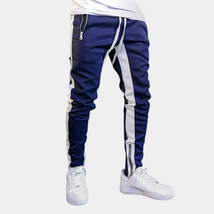 Blå herr joggingbyxa Finn med vit kontrastlinje på benet