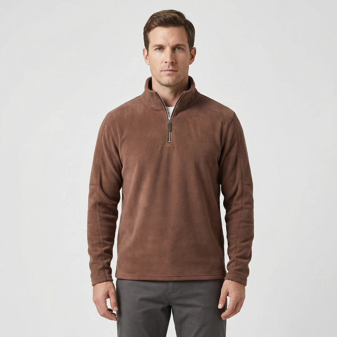 Detaljbild på material och sömmar i den svarta skidtröjan för herrar