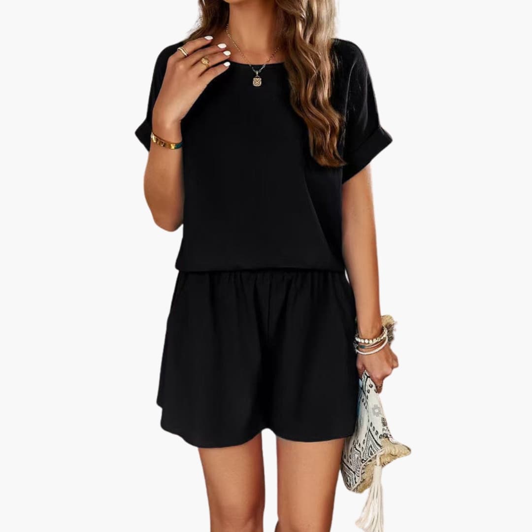Svart elegant damjumpsuit med korta ärmar och praktisk elastisk midja