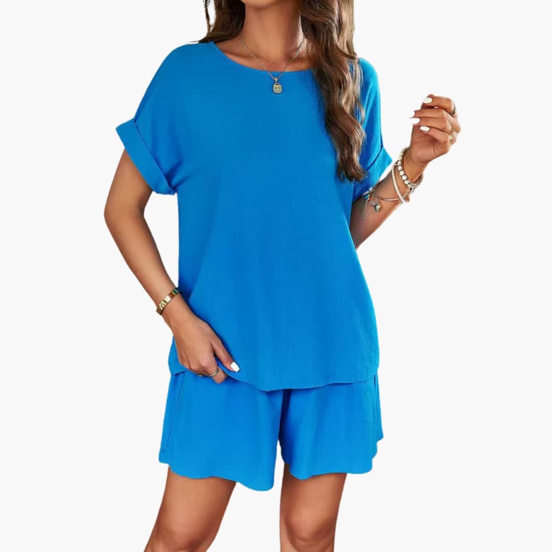 Blå kortärmad jumpsuit för dam med bekväm passform och skön stretch i midjan