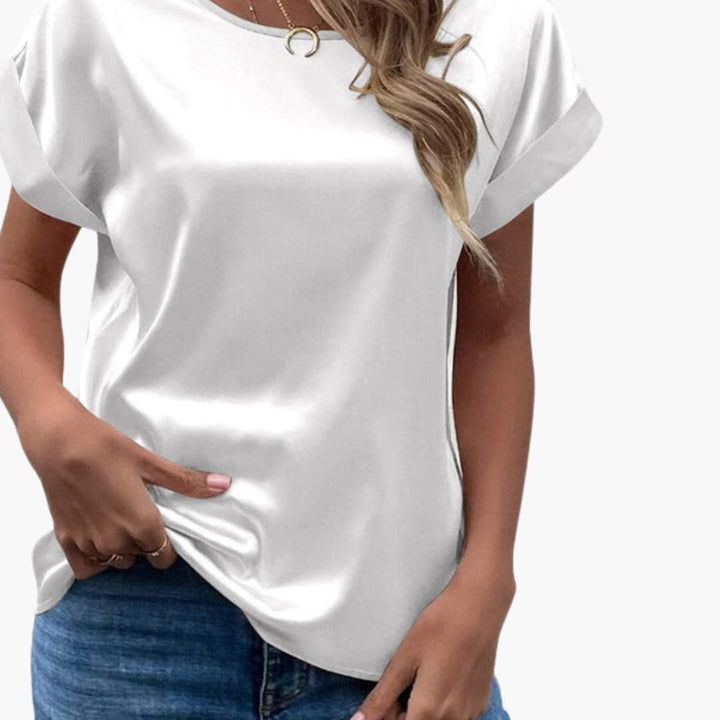 Klassisk rundhalsad blus i behagligt material för dam