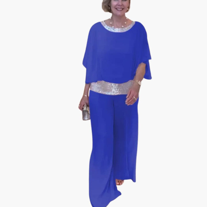 Elegant jumpsuit för dam med raka ben och glänsande detaljer, perfekt som festklädesalternativ.