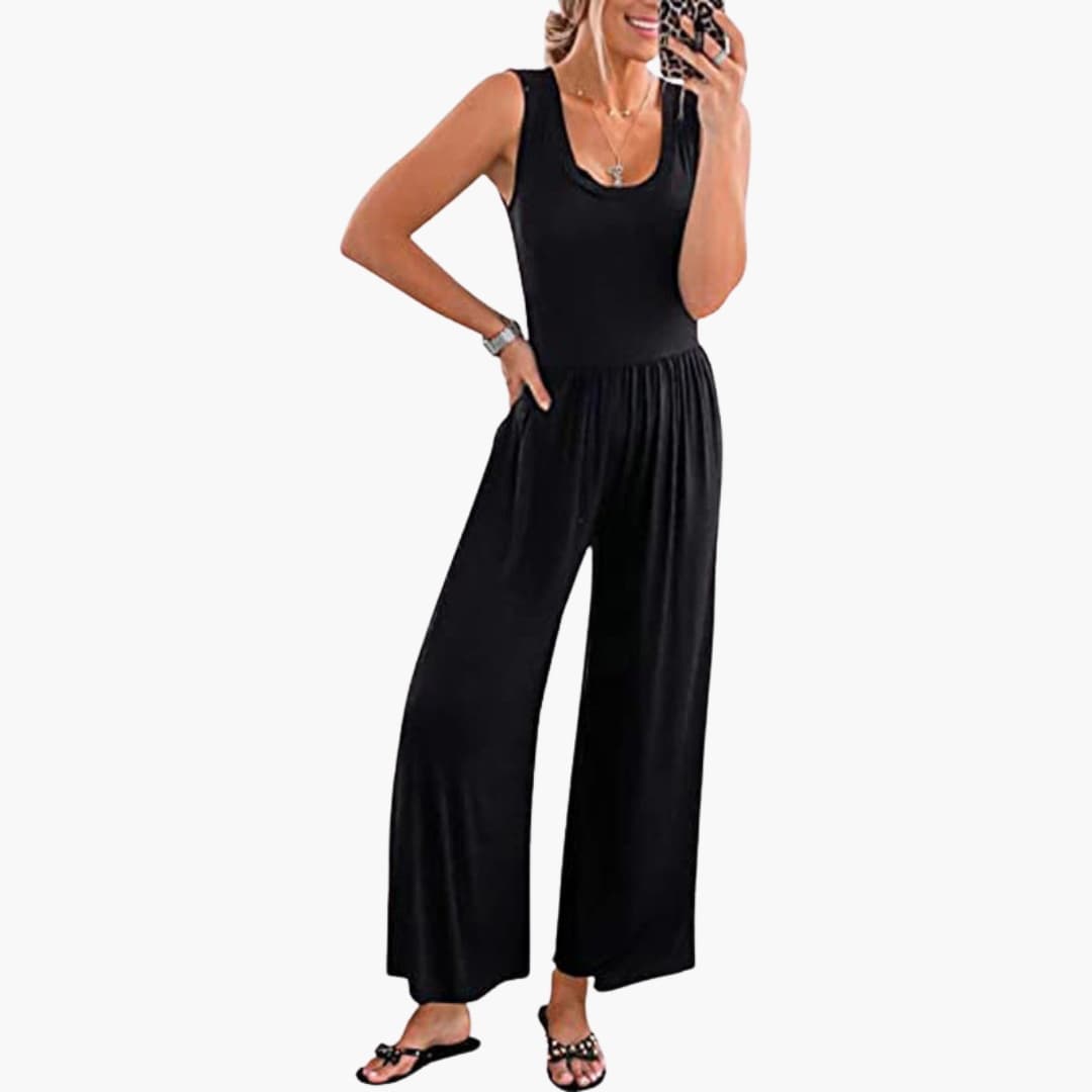 Svart ärmlös jumpsuit för dam med vida ben och skärp i midjan, elegant vardagsmode