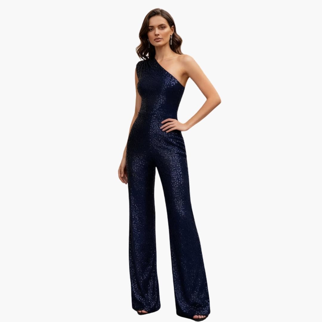 Kvinna i marinblå paljettjumpsuit för festliga tillfällen