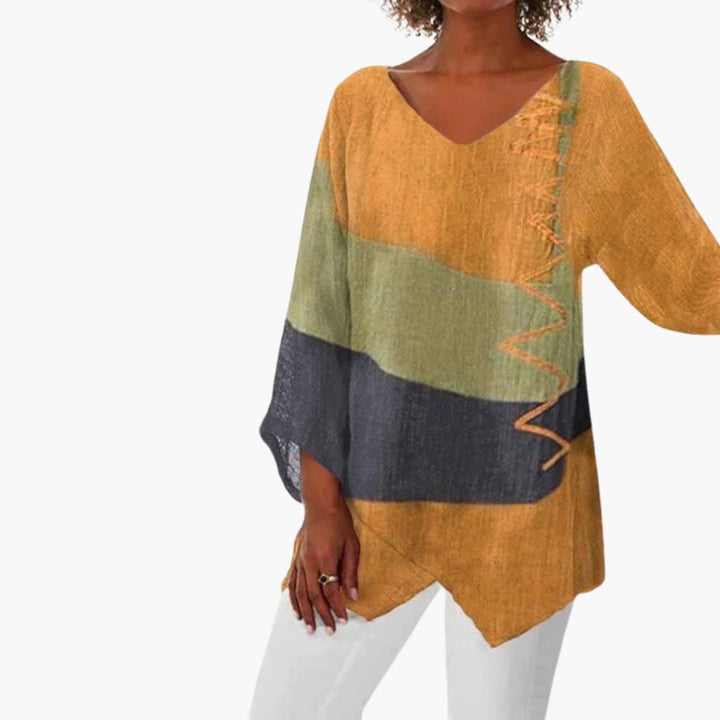 Dam långärmad blus i gul trikolordesign med rund halsringning