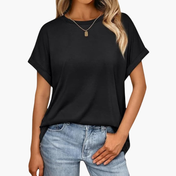 Svart långtshirt och basplagg för dam med uppvikta ärmar, baksida