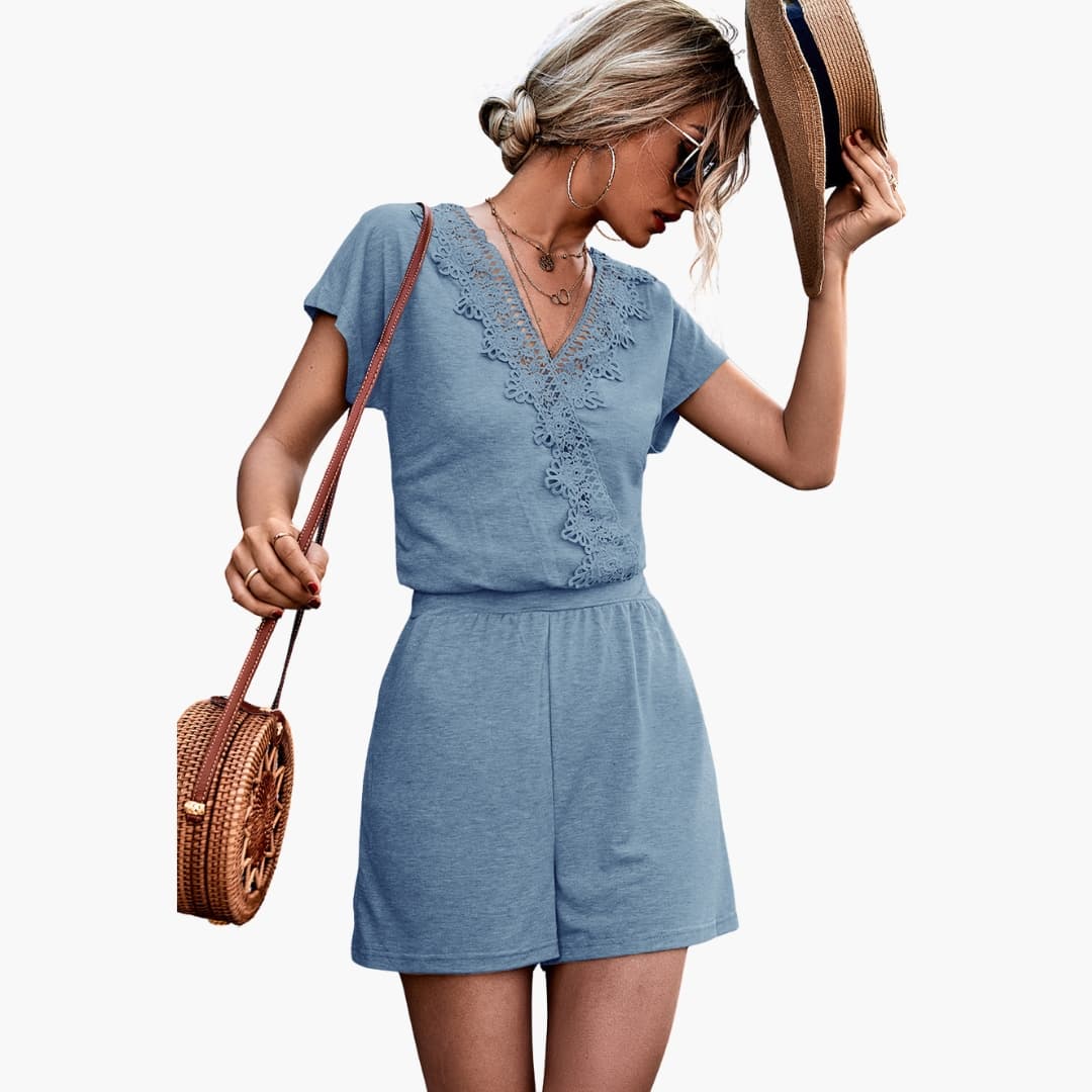 Blå dam jumpsuit med V-ringning och virkade detaljer
