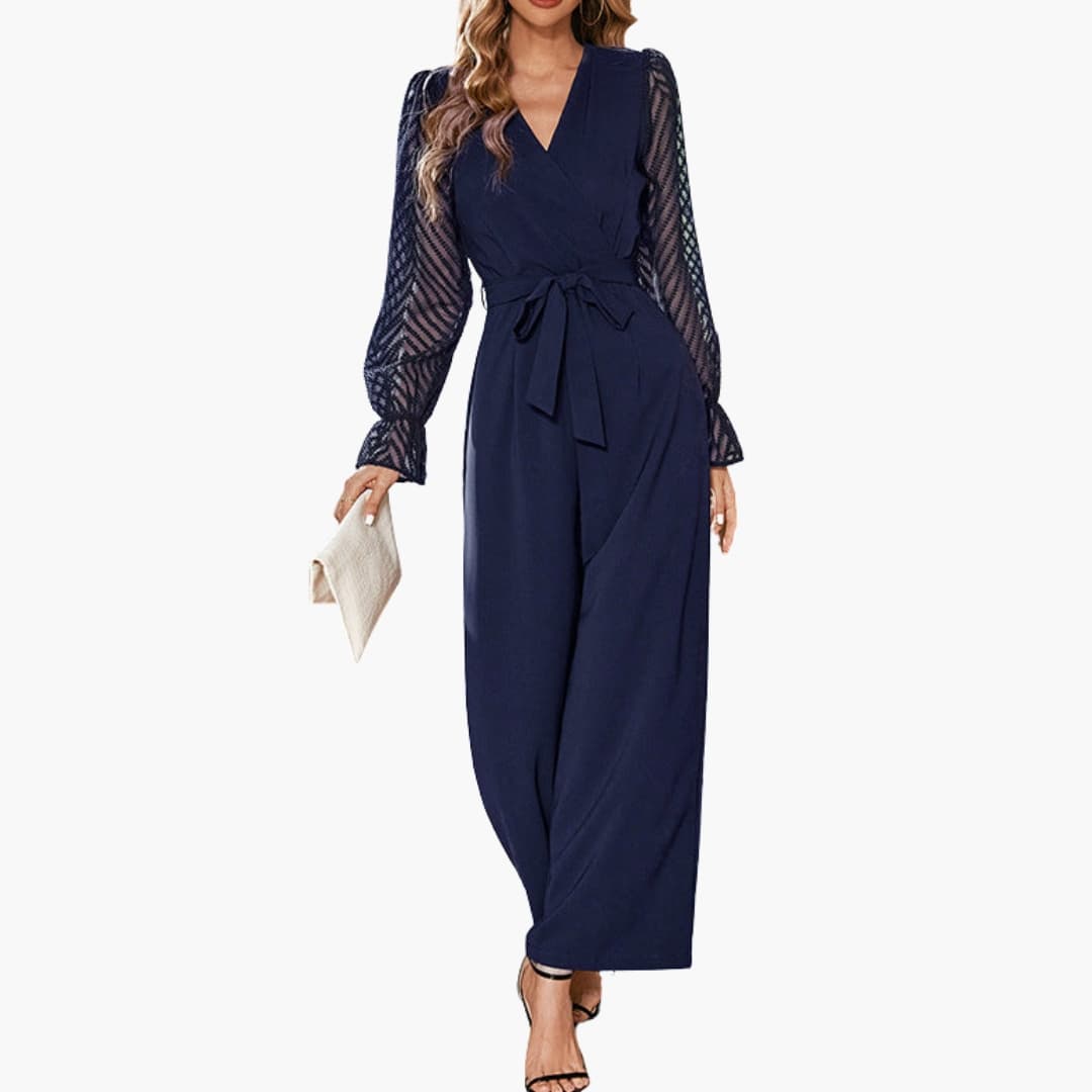 Dam mörkblå jumpsuit med V-ringning och genomskinliga ärmar framifrån