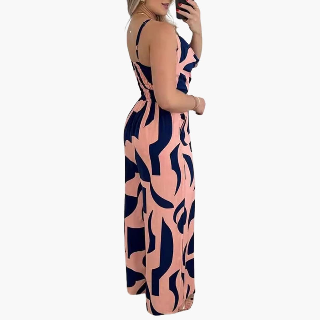 Rosa och blåmönstrad jumpsuit visad från sidan