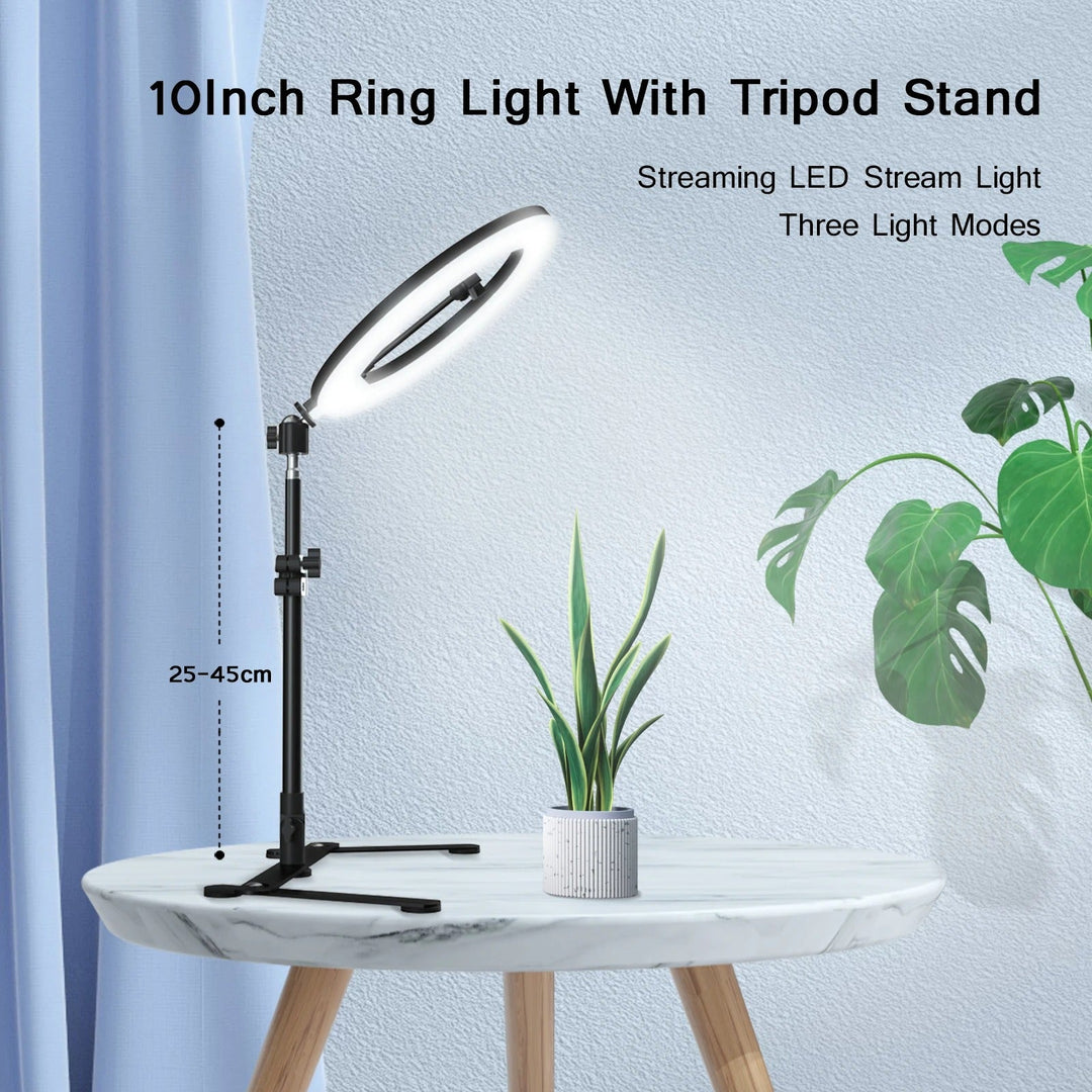 Ring light stativ med justerbar höjd och växt på bord