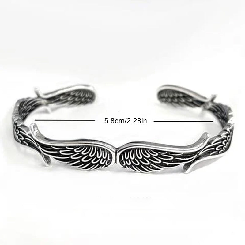 "Änglavingar armband i koppar vintagestil, unisex design, justerbar, symbol för skydd och mod, elegant och tidlös look."