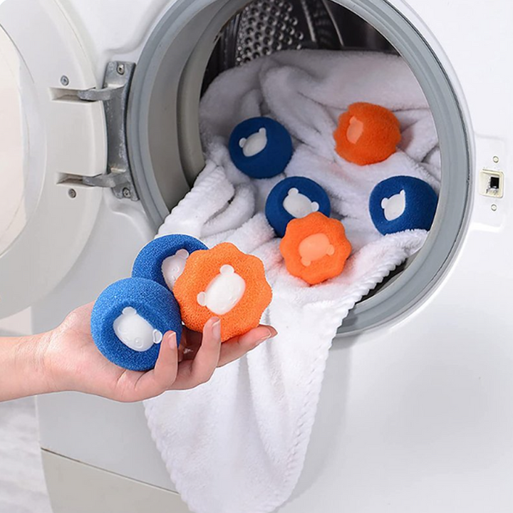 "Återanvändbar tvättkula, orange/blå, avlägsnar hår och ludd effektivt. Kompakt, hållbar och skonsam mot kläder."