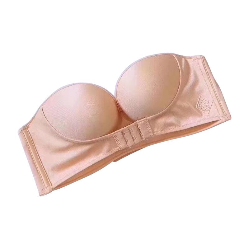 Axelbandslös BH för dam med frontknäppning i beige, formande stöd och antihalkdesign.