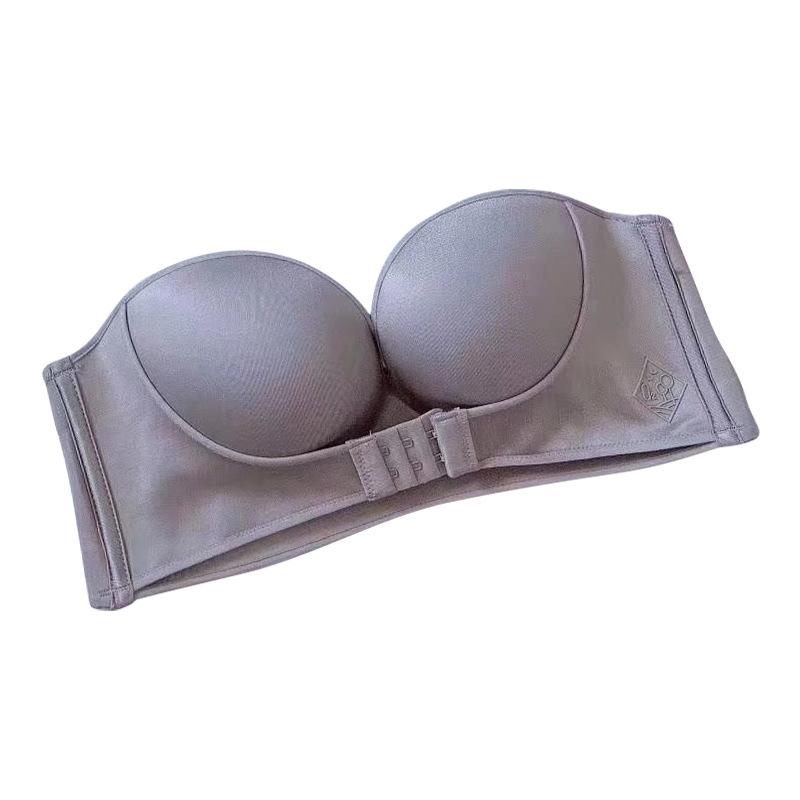 Axelbandslös BH för dam med frontknäppning i beige, formande stöd och antihalkdesign.