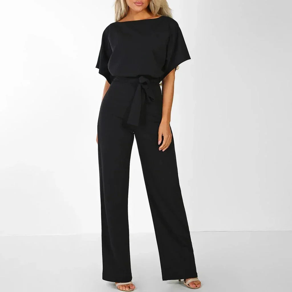 Närbild på tyg och det eleganta skärpet till damjumpsuit för festkläder