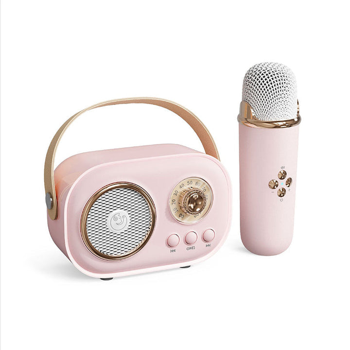 Bärbar Bluetooth-högtalare för barn med trådlös mikrofon, kompakt design, perfekt för karaoke och musikupplevelser.