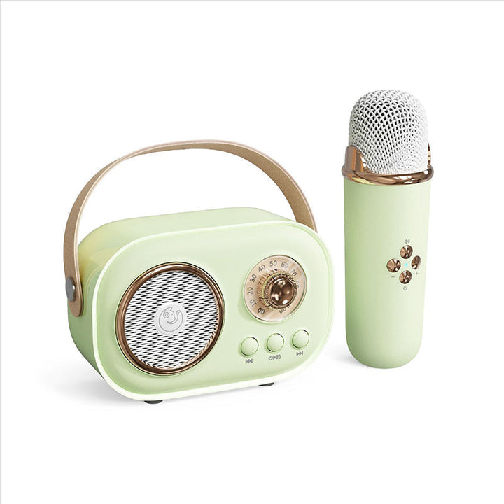 Bärbar Bluetooth-högtalare för barn med trådlös mikrofon, kompakt design, perfekt för karaoke och musikupplevelser.