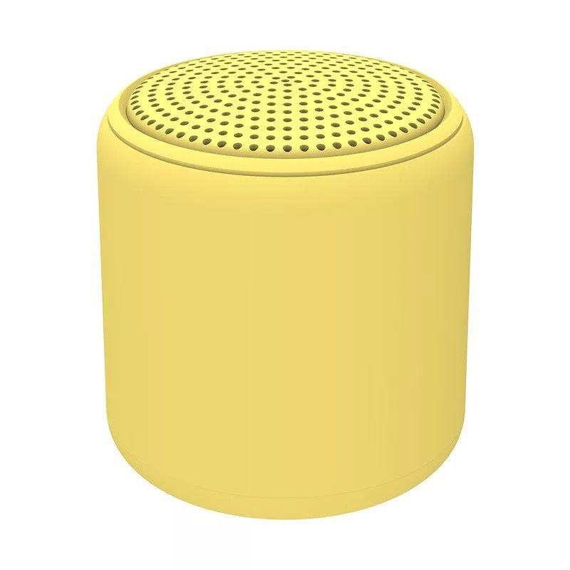 "Bärbar trådlös Bluetooth-högtalare i macaroon-färg med modern design, kompakt och lätt, perfekt för resor och hemmet."