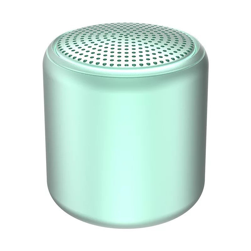 "Bärbar trådlös Bluetooth-högtalare i macaroon-färg med modern design, kompakt och lätt, perfekt för resor och hemmet."