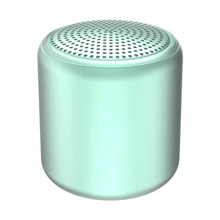 "Bärbar trådlös Bluetooth-högtalare i macaroon-färg med modern design, kompakt och lätt, perfekt för resor och hemmet."