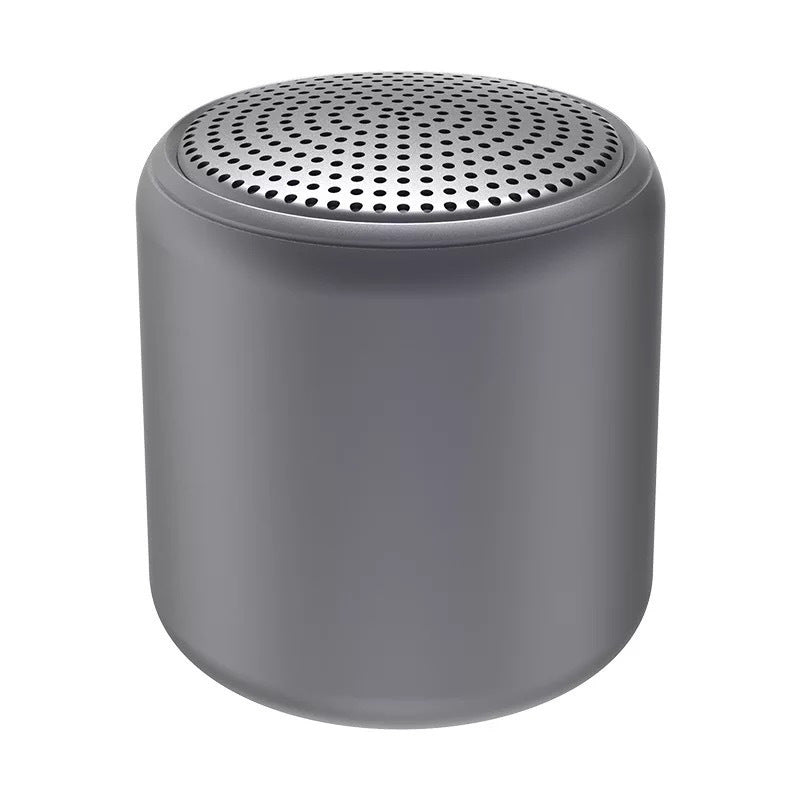 "Bärbar trådlös Bluetooth-högtalare i macaroon-färg med modern design, kompakt och lätt, perfekt för resor och hemmet."