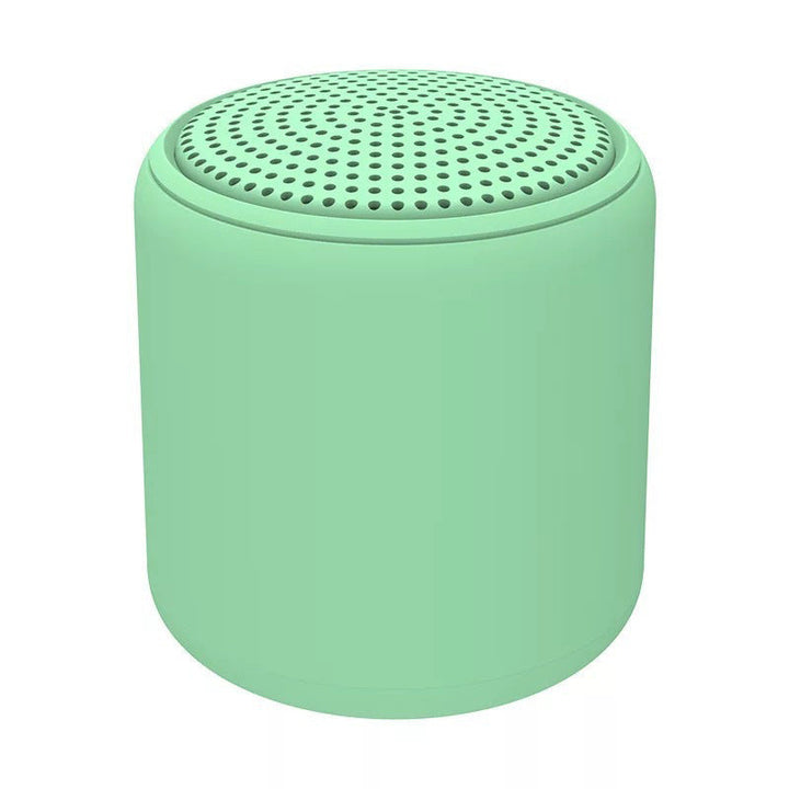 "Bärbar trådlös Bluetooth-högtalare i macaroon-färg med modern design, kompakt och lätt, perfekt för resor och hemmet."
