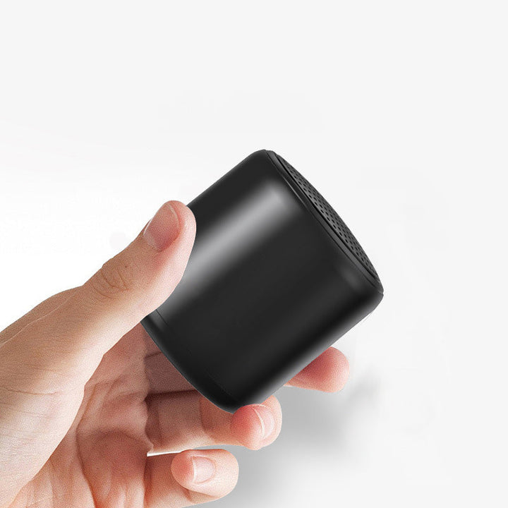"Bärbar trådlös Bluetooth-högtalare i macaroon-färg med modern design, kompakt och lätt, perfekt för resor och hemmet."