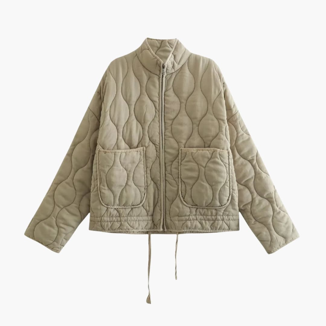 Grå stilfull zip-jacka för dam, quiltad design. Ett trendigt ytterplagg som passar alla tillfällen.
