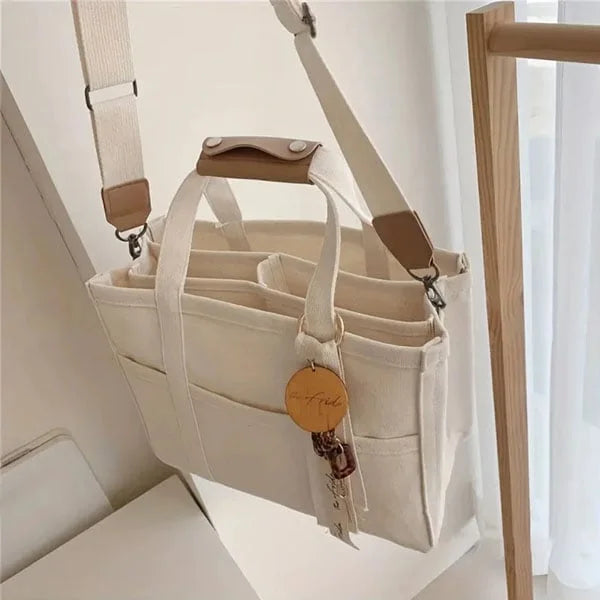 Beige unisex bärkasse, rymlig vardagsväska för shopping & förvaring. Stilfull & praktisk axelväska.