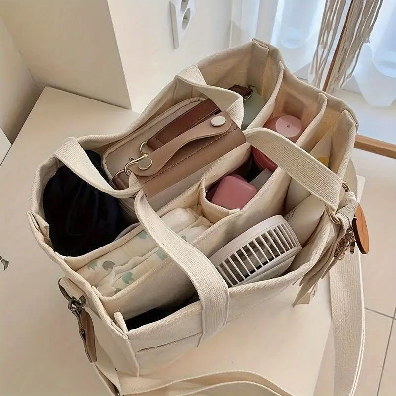 Svart unisex bärkasse, elegant axelväska för vardag & shopping. Praktisk förvaring för dina accessoarer.