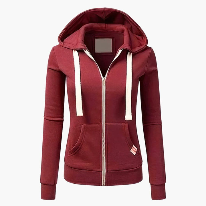 Röd dam zip hoodie med huva. En avslappnad och bekväm huvtröja för kvinnor, perfekt som en trendig och funktionell vardagsplagg.