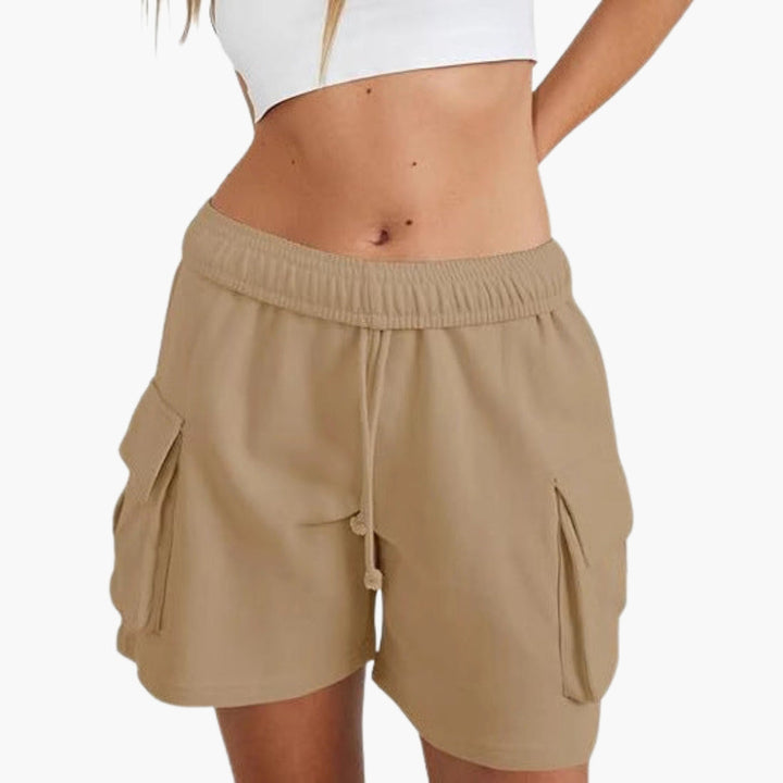 Dambyxor cargomodell: Funktionella byxor med dragsko och flera fickor, perfekta för en bekväm och casual stil.