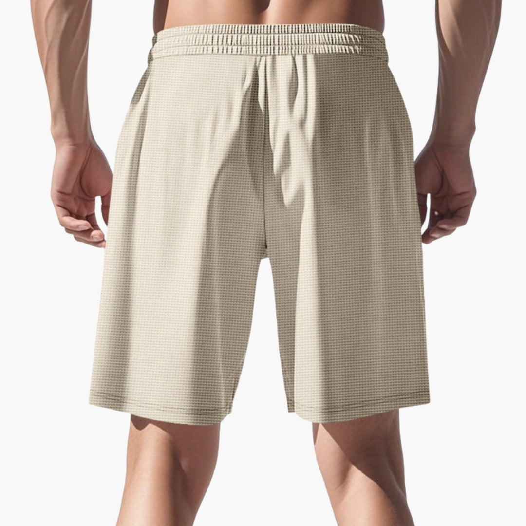 Svarta casualshorts för män, med dragsko och fickor, idealiska för sommar och sport.
