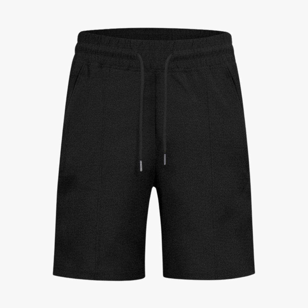 Blå herrshorts med dragsko och fickor, bekväma fritidsshorts för aktiv livsstil.