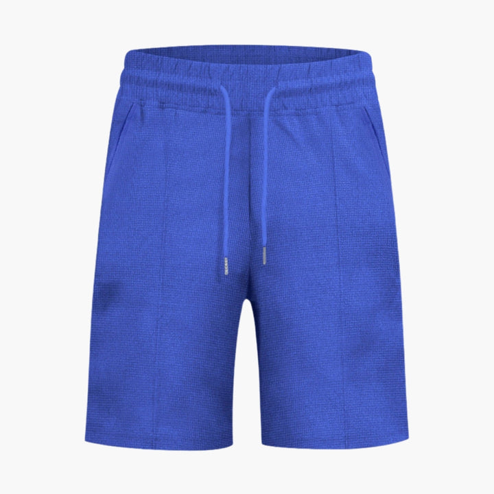 Stilrena herrshorts med dragsko, fickor och elastisk midja, perfekta för sommaraktiviteter.
