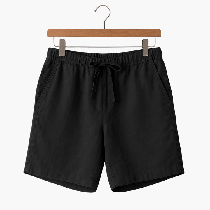 Baksida av herrshorts med rymliga fickor och komfortabel elastisk midja, bra för fritid och vardag.
