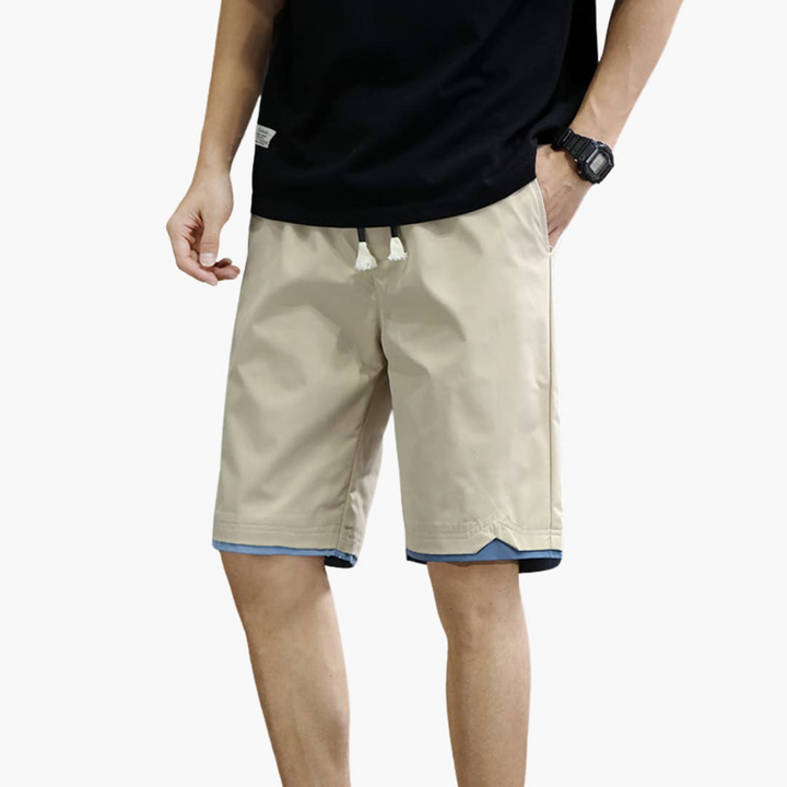 Mångsidiga herrshorts med elastisk midja och dragsko. Bekväma vardagsshorts, sommarshorts och fritidskläder.