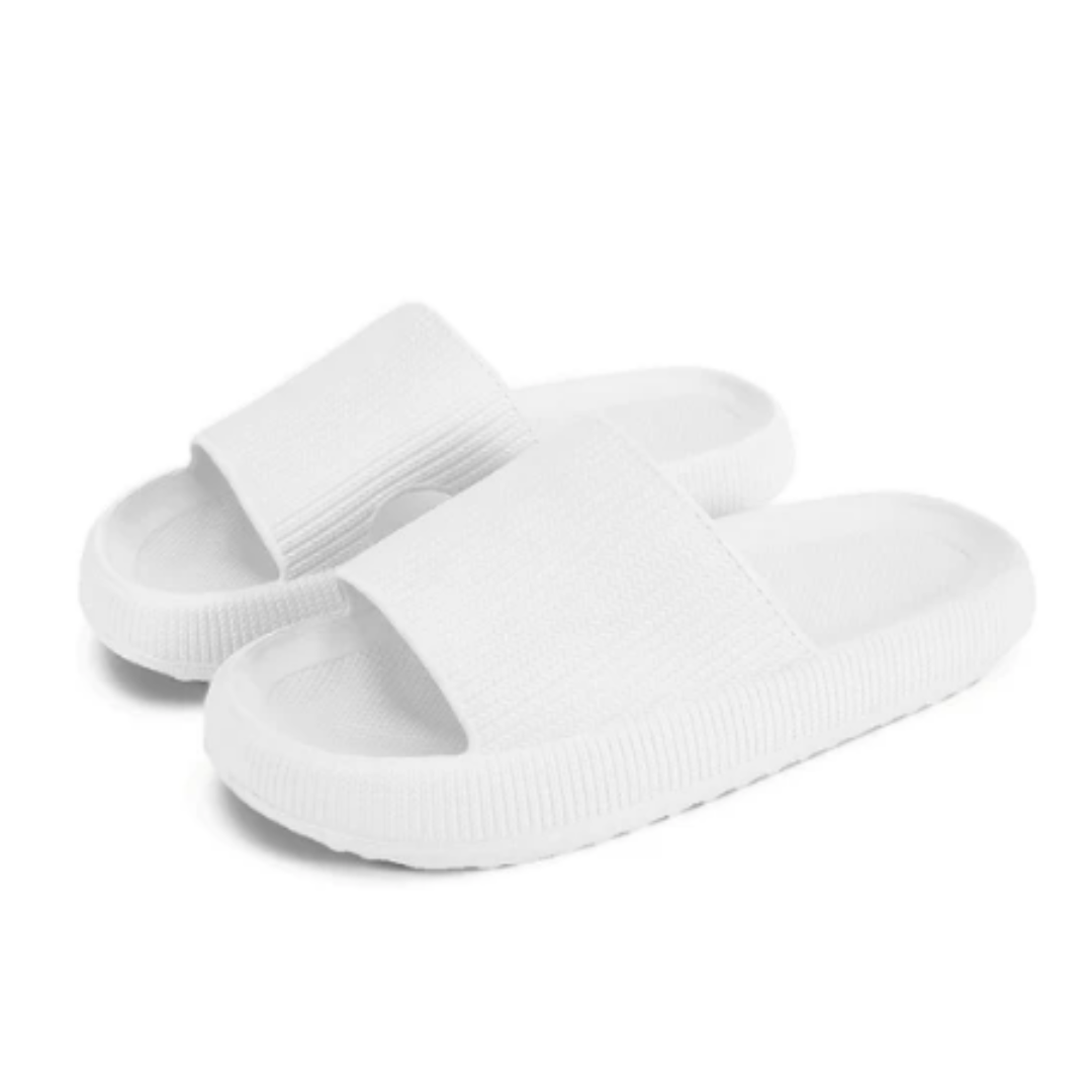 Tofflor med ergonomiskt fotstöd för avlastning. Komfortskor med stötdämpande sula för fötterna.