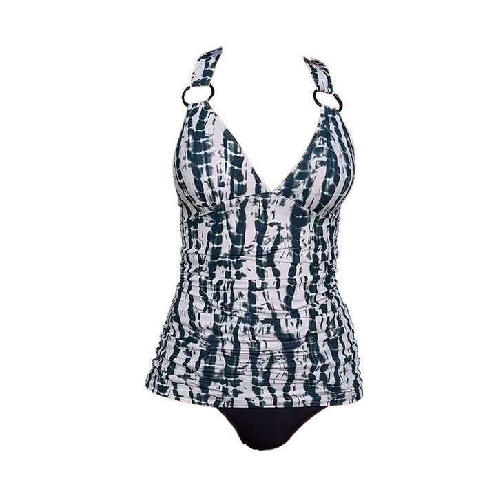 Blå dam tankini i mjukt badklädesmaterial med modern vikdesign. Snyggt strandmode för sommarens aktiviteter.