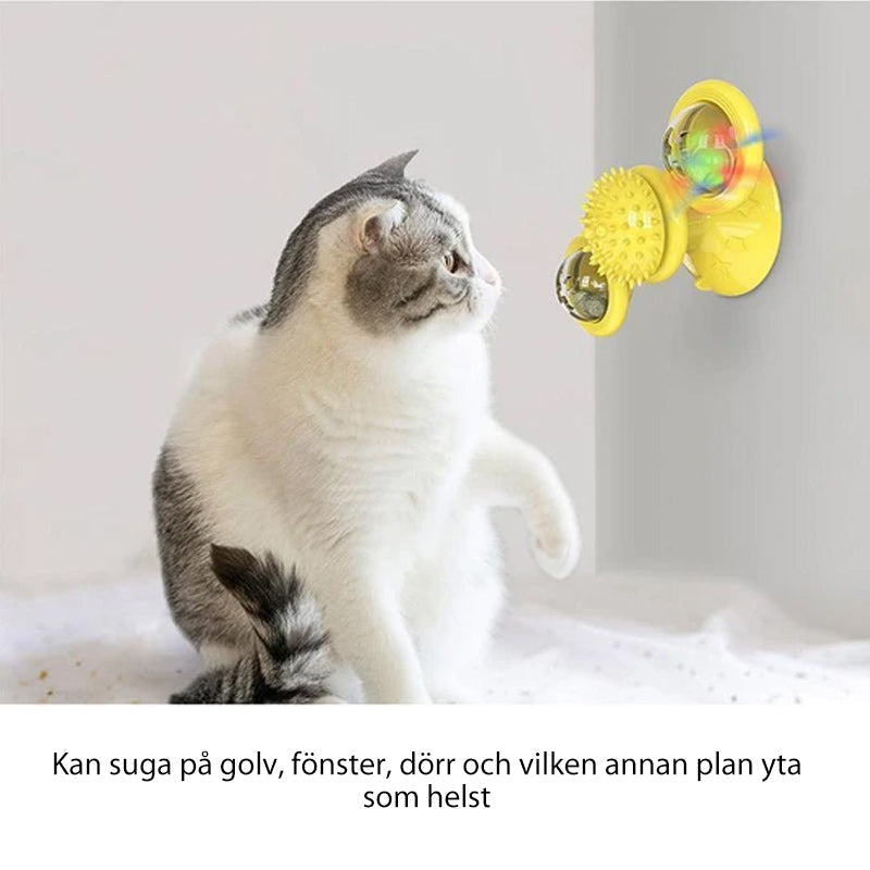 "Blå interaktiv väderkvarn kattleksak med genomskinliga behållare och gummiplexus i mitten på vit bakgrund."