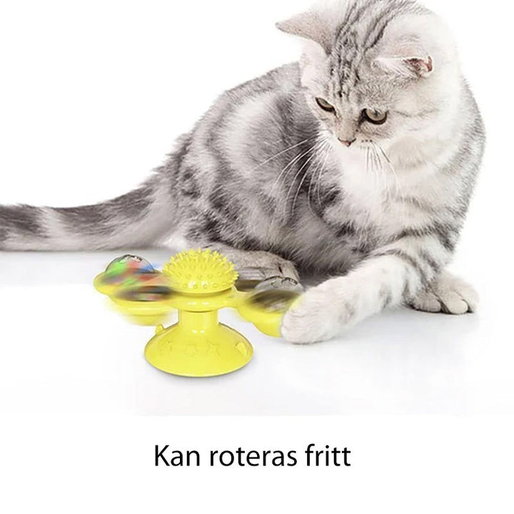 "Blå interaktiv väderkvarn kattleksak med genomskinliga behållare och gummiplexus i mitten på vit bakgrund."