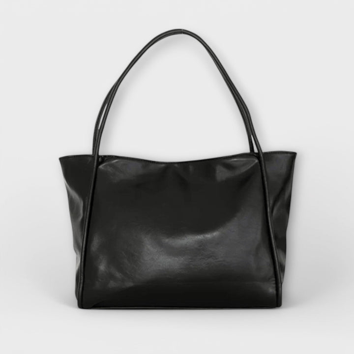 Olivia dam tote-väska i svart framifrån mot ljus bakgrund